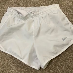 White Nike running shorts